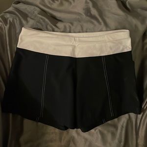 Lululemon size 4 Black shorts white band.
